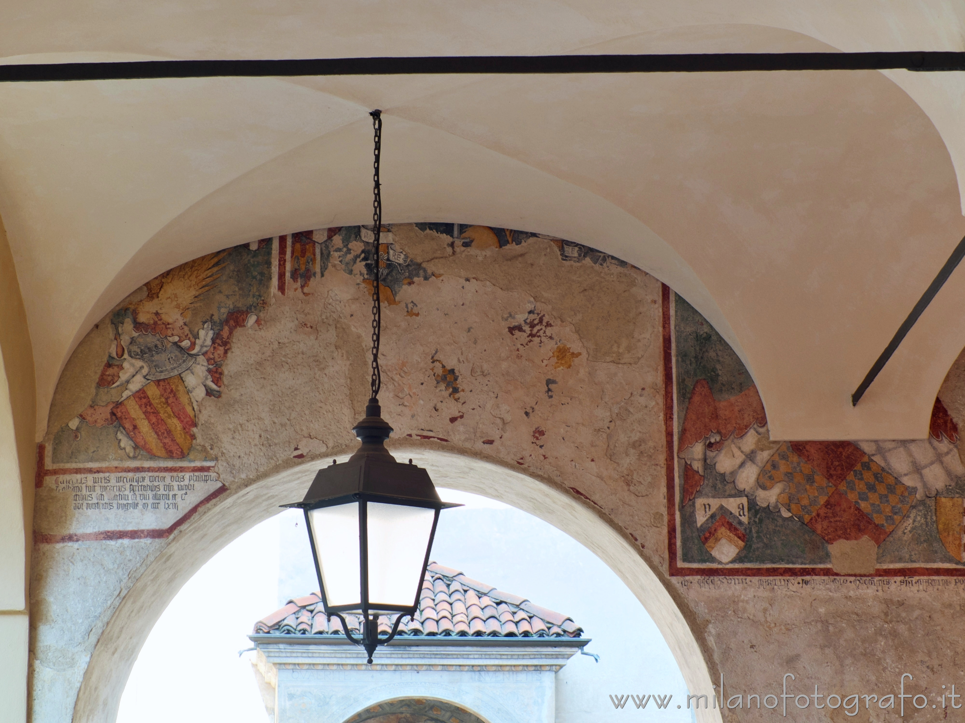 Biella (Italy) - Frescoes under the arcades in Cisterna square at the corner with Piazzo avenue